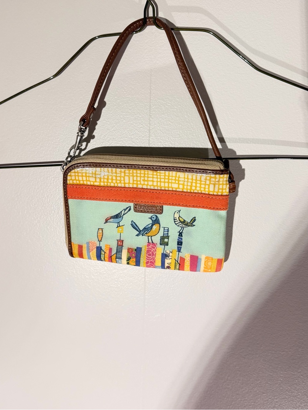 Fossil Mint Bird Canvas Wristlet with Orange, Yellow & Brown Accents